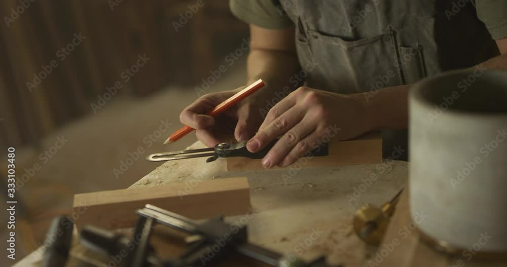 Woodworker man working in garage