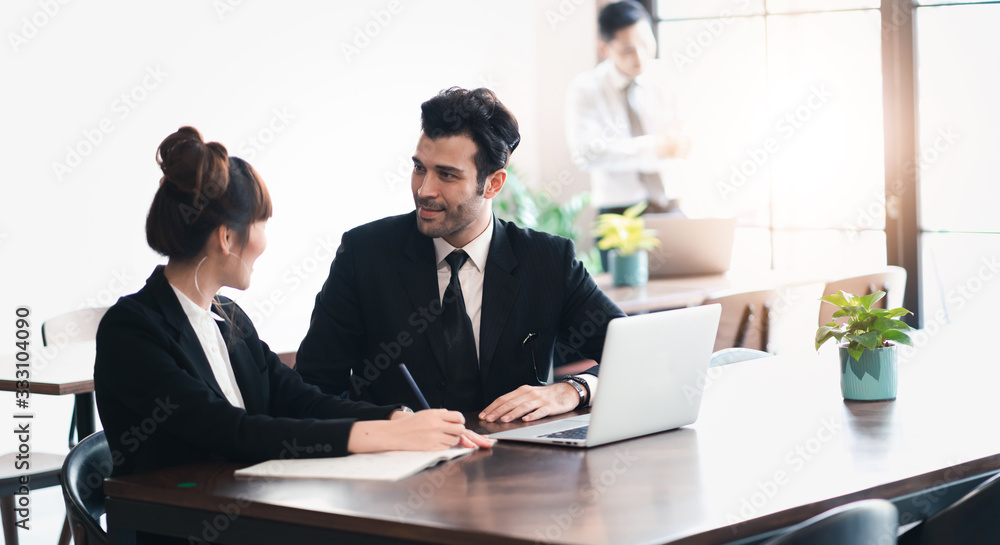 Young asian business group discussion in office workplace. lifestyle social distance friends meeting corporate office. Young asian business group discussion in office workplace. lifestyle social distance friends meeting corporate office.
