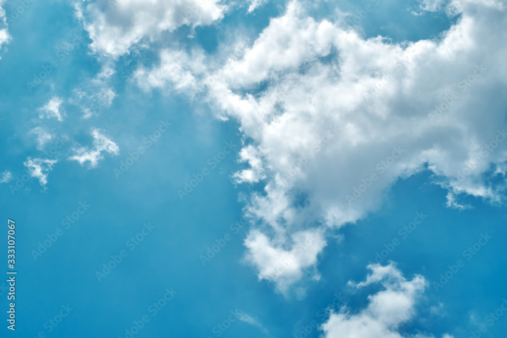Fototapeta premium Blue sky blackground with flare cloud in the clear day