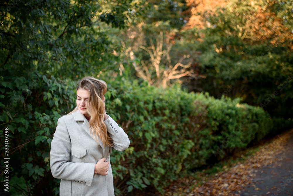 Portrait of a beautiful autumn woman. Girl posing to the camera. Portrait of a beautiful autumn woman. Girl posing to the camera.