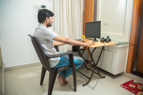 Young Indian freelancer work form home office using computer. virtual training, remote studying, online education, internet, webinar, teacher. Technology. Career and job opportunity, content writer. 