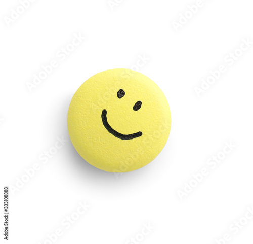 Pill with drawn face on whi...