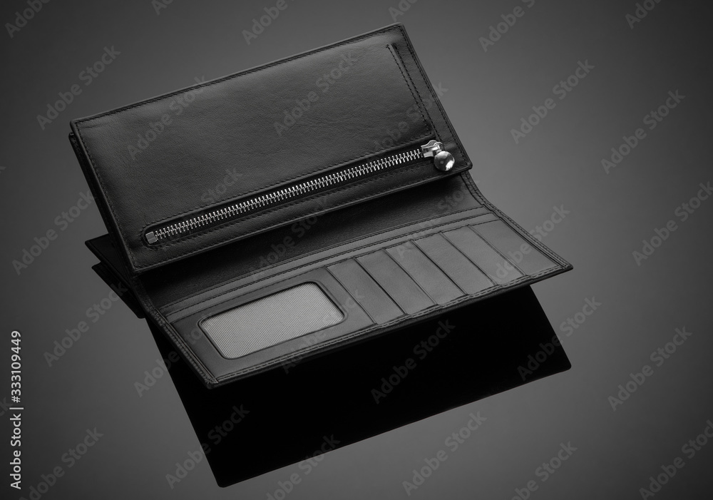 Fashionable leather men's wallet on a dark background Fashionable leather men's wallet on a dark background