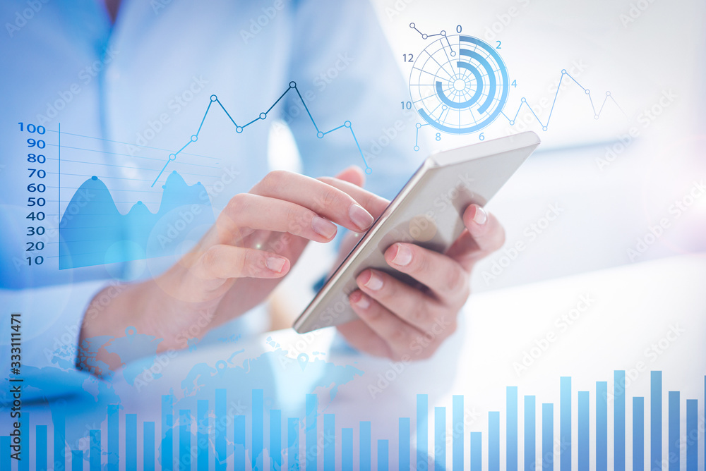 Person holding smart phone with financial analysis graphs. Digital gadget. Technology and communication concept. Cropped view. Person holding smart phone with financial analysis graphs. Digital gadget. Technology and communication concept. Cropped view.