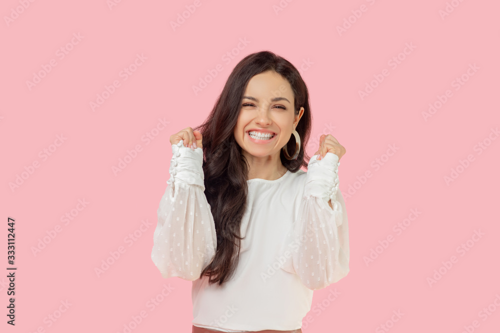 Young woman in a white blouse looking happy Young woman in a white blouse looking happy