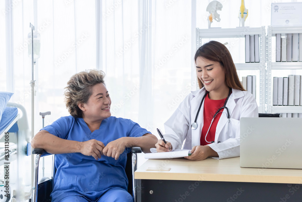 Young attractive Asian doctor is discussing to the patient about her symptoms, healtcare and hospital concept. Young attractive Asian doctor is discussing to the patient about her symptoms, healtcare and hospital concept.