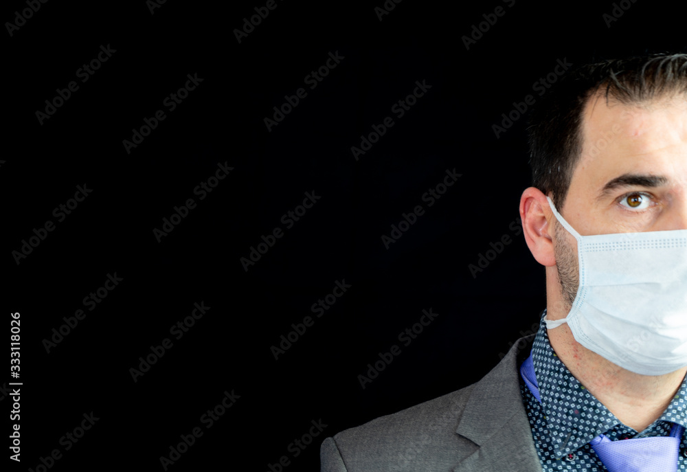 Young man in suit and mask to prevent coronavirus posing Young man in suit and mask to prevent coronavirus posing