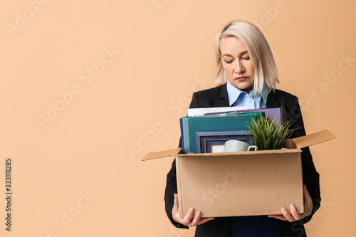 Sad fired mature woman with...
