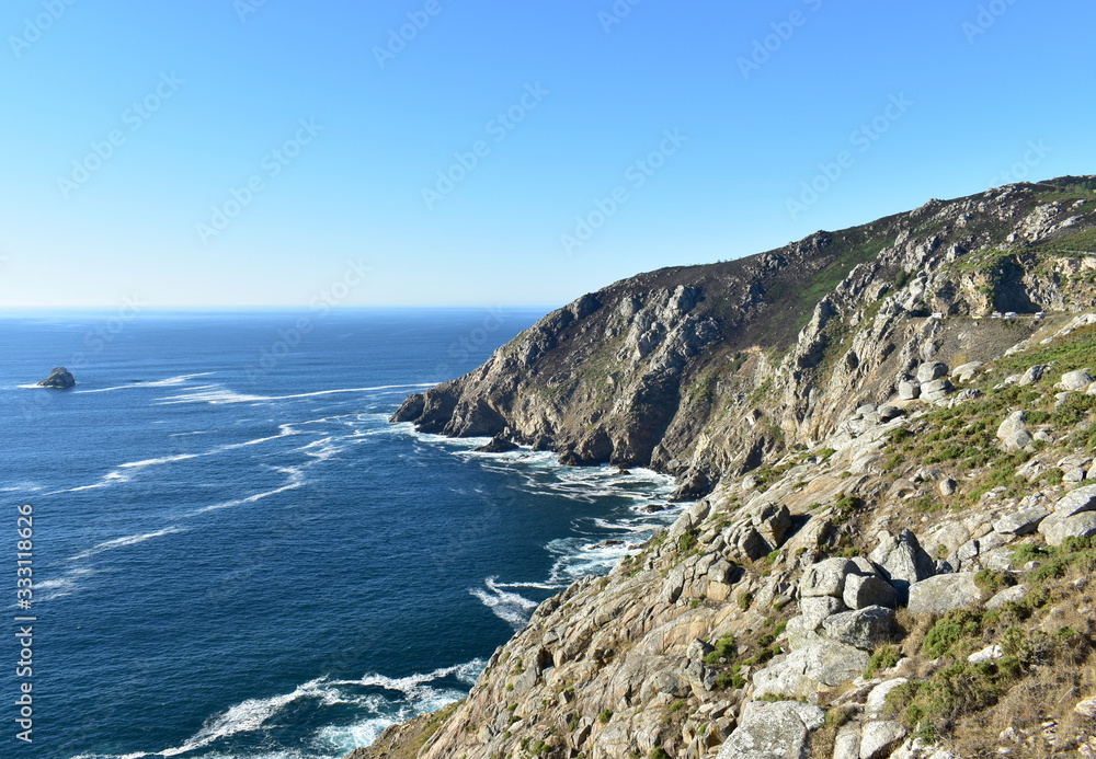 Famous Cape Finisterre or Fisterra known as The End of the World and final stage of Camino de Santiago european religious pilgrimage. Coruña, Galicia, Spain.
