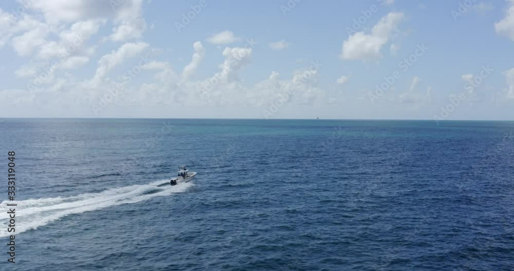 Aerial View of center console fishing boat in ocean Aerial View of center console fishing boat in ocean