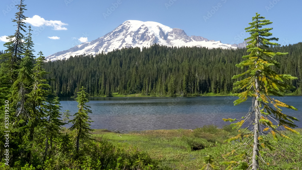 afternoon view of mt rainier and shoreline at reflection lake