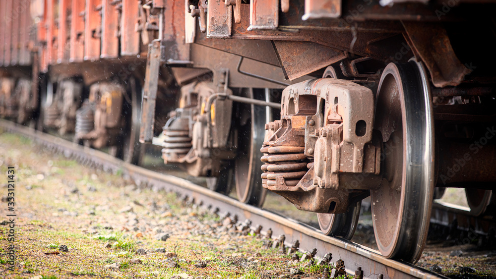 Train wheels closeup, selective focus. Rolling stock on track. Train wheels closeup, selective focus. Rolling stock on track.