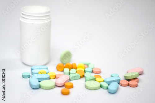 pills and bottle on white background