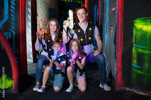 Family posing with laser pistols