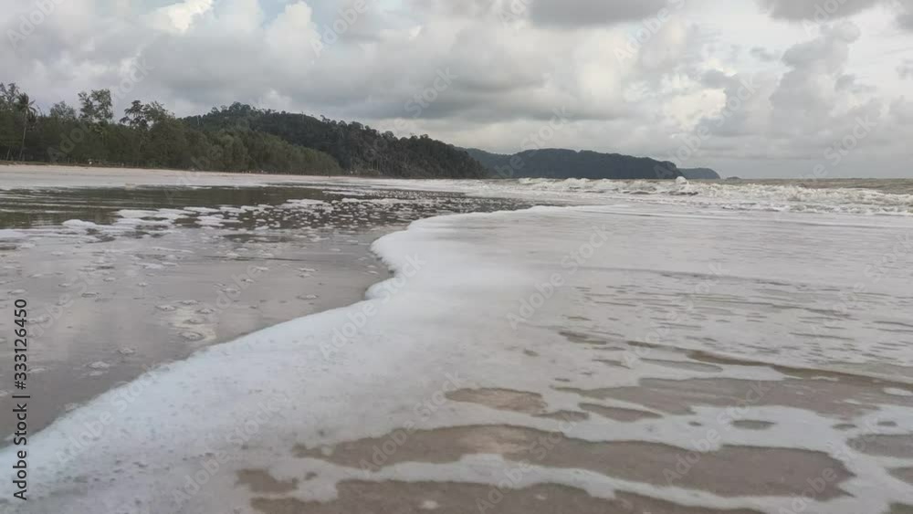 A view of the public beach at Air Papan Beach, Mersing, Malaysia. A quiet afternoon without visitors. A view of the public beach at Air Papan Beach, Mersing, Malaysia. A quiet afternoon without visitors.