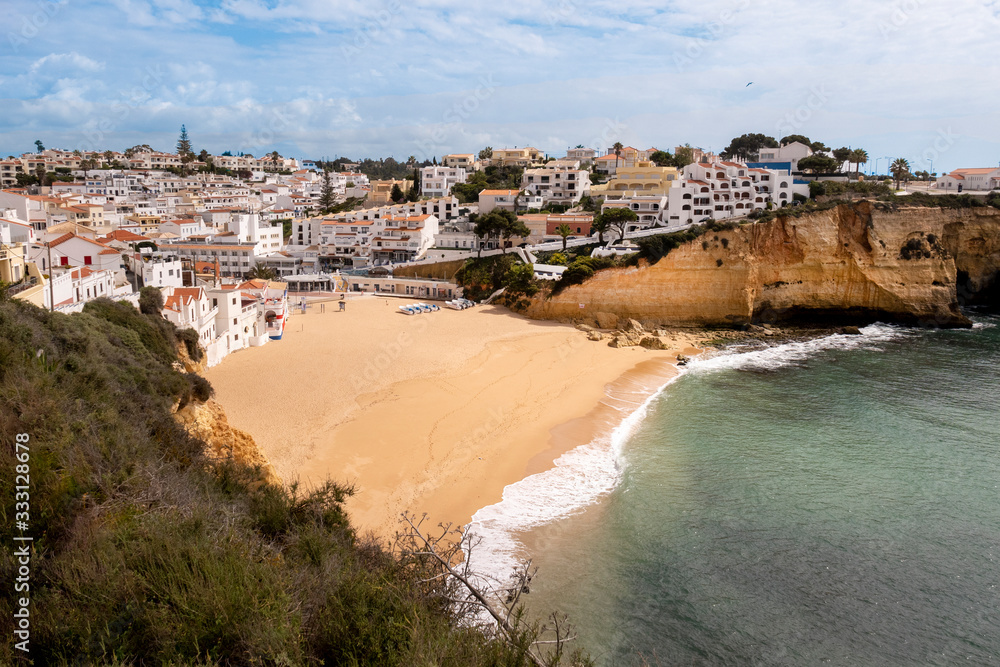 view to village of Carvoeiro with scenic beach in Portugal