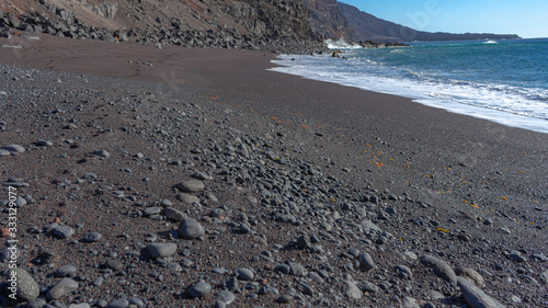 Red sand beach, El Verodal on the Island of El Hierro. photo