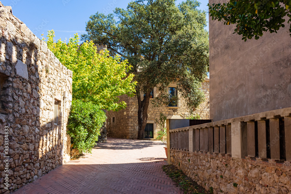 Street in the historic center of the town of Saint Marti of Ampuries, Costa Brava, Catalonia, Spain