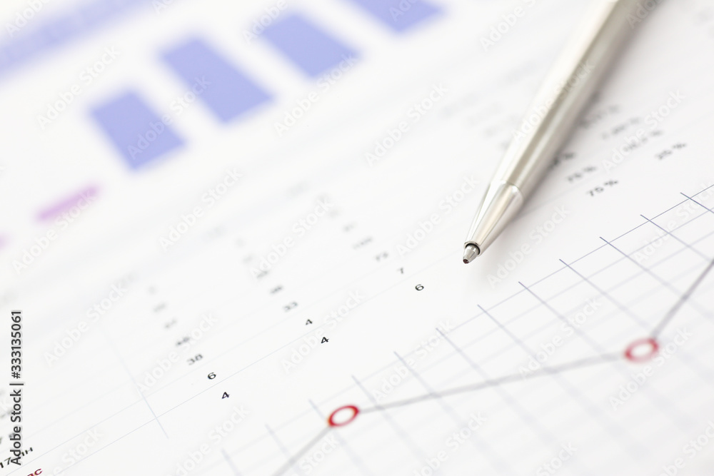 Financial statistics documents on clipboard pad at office table closeup. Internal Revenue Service inspector sum check, irs investigation, exchange market, earnings, savings, loan and credit concept Financial statistics documents on clipboard pad at office table closeup. Internal Revenue Service inspector sum check, irs investigation, exchange market, earnings, savings, loan and credit concept