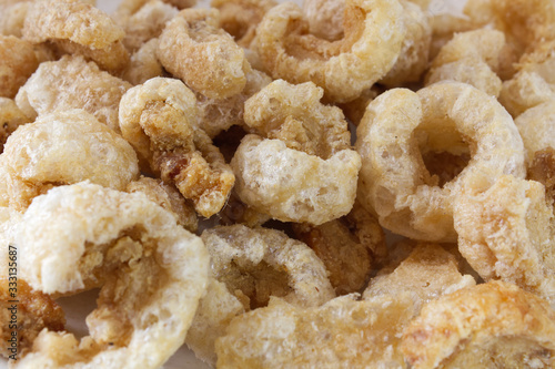 Crispy pork rinds, pork cracklings, fried pork rinds, traditional Thai food and appetizer