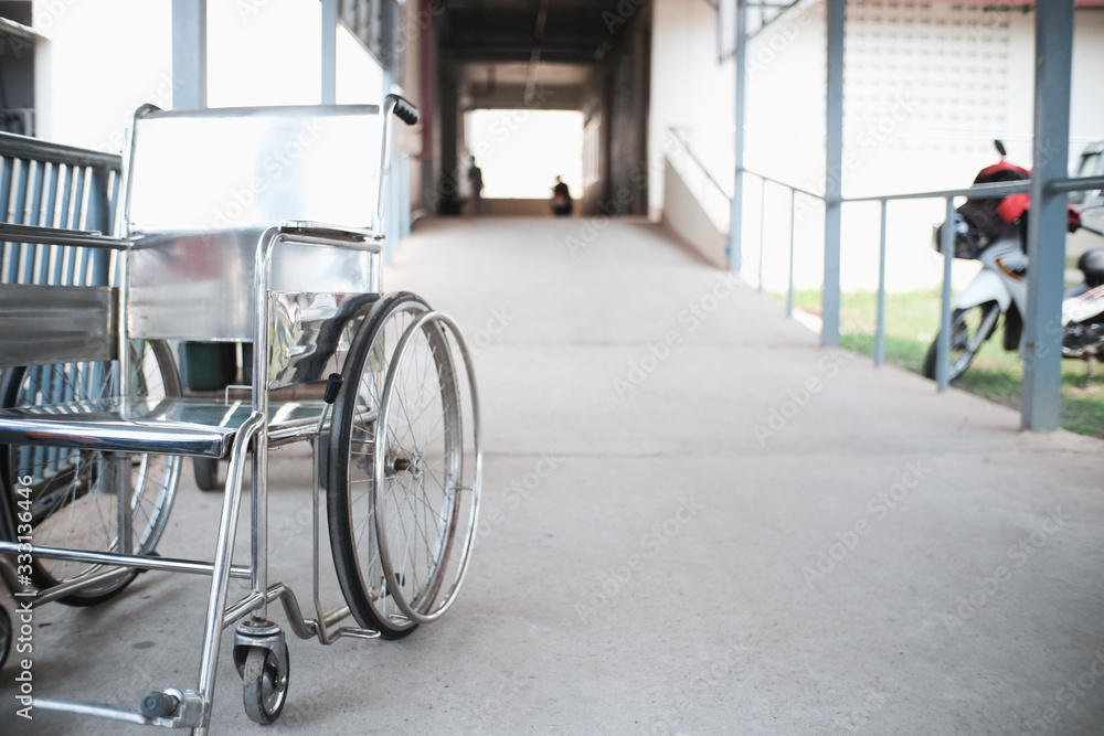 Fototapeta premium wheelchair in hospital corridor