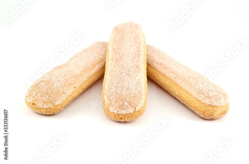 Savoiardi biscuits, also known as Ladyfingers,on white background. They are sweet sponge cookies used also in many desserts