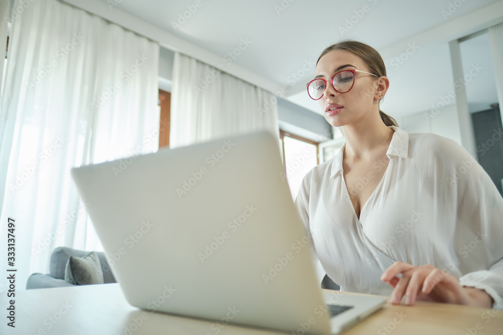 a woman works at home during an epidemic or quarantine a woman works at home during an epidemic or quarantine