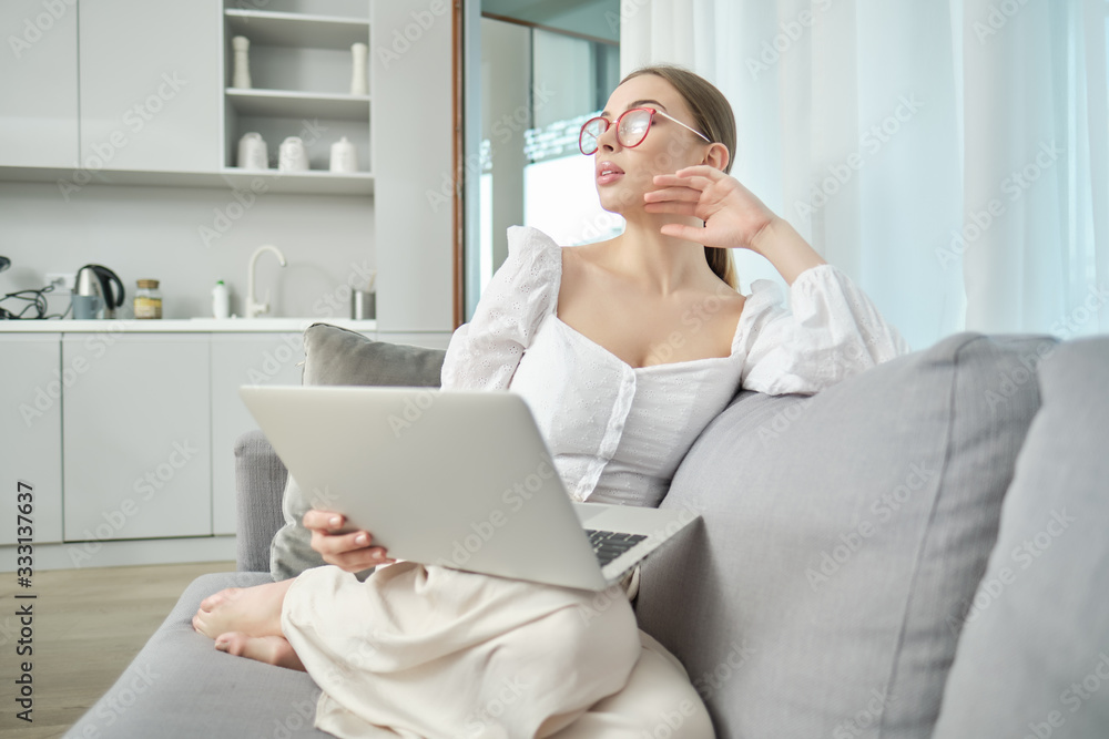 a woman works at home during an epidemic or quarantine a woman works at home during an epidemic or quarantine