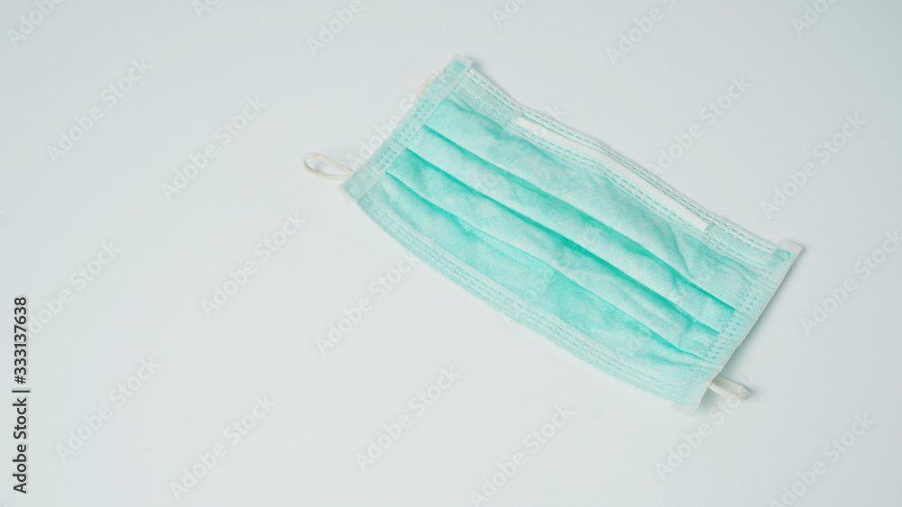 Disposable Ear- loop face mask on white background. Disposable Ear- loop face mask on white background.