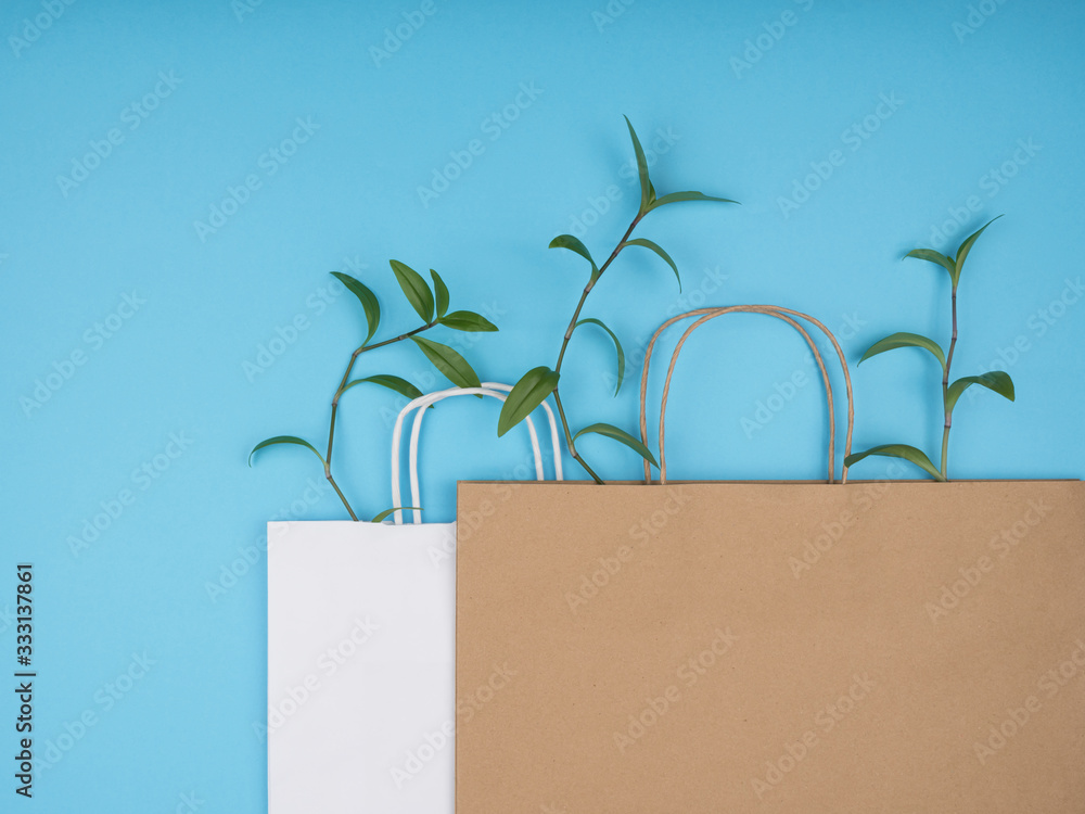 Paper shopping bags on blue background. Paper shopping bags on blue background.