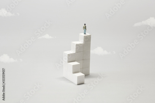 man on the top of white minimal abstract stairs photo