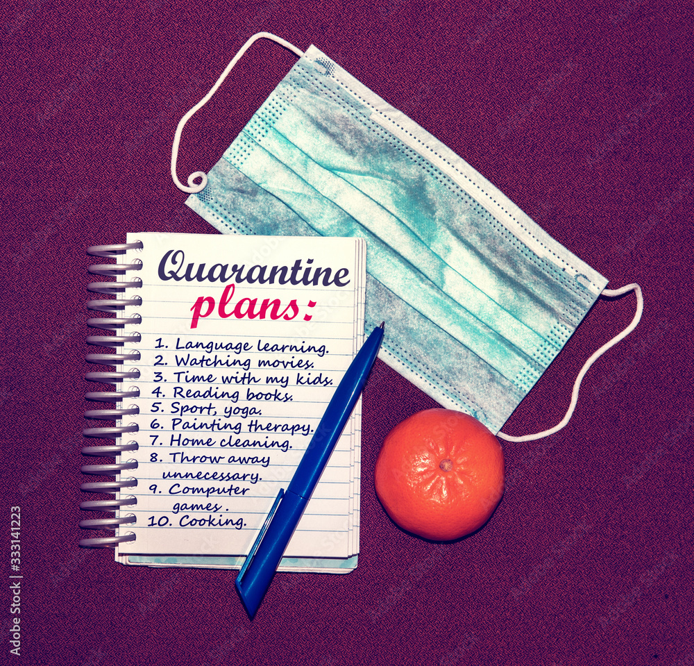 An abstract image of a medical mask and a notebook with plans for what to do while a coronavirus quarantin
