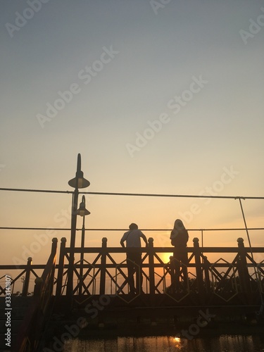 Evening suspension bridge creates a romantic atmosphere