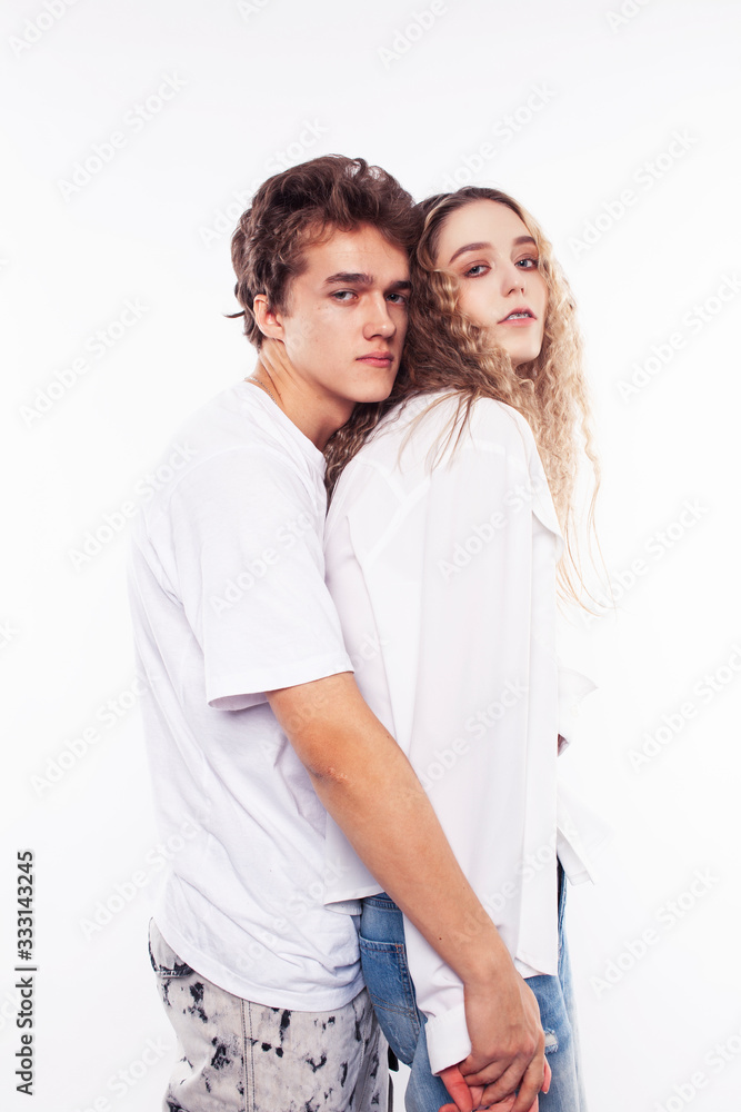 young pretty couple together posing cheerful isolated on white background, lifestyle people concept, happy boy and girl young pretty couple together posing cheerful isolated on white background, lifestyle people concept, happy boy and girl