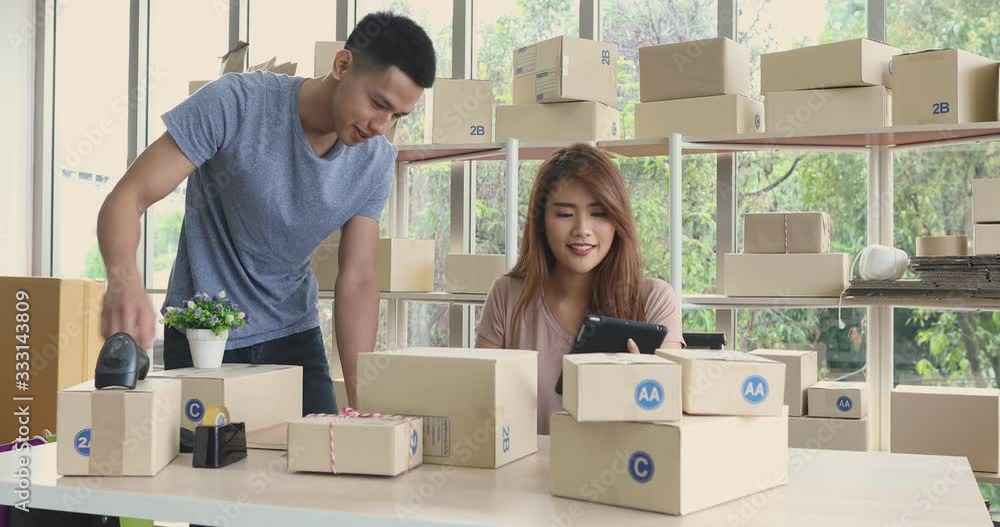 Asian couple have a order, woman using tablet computer for checking product stock and man helping her.
Asian couple have a order, woman using tablet computer for checking product stock and man helping her.