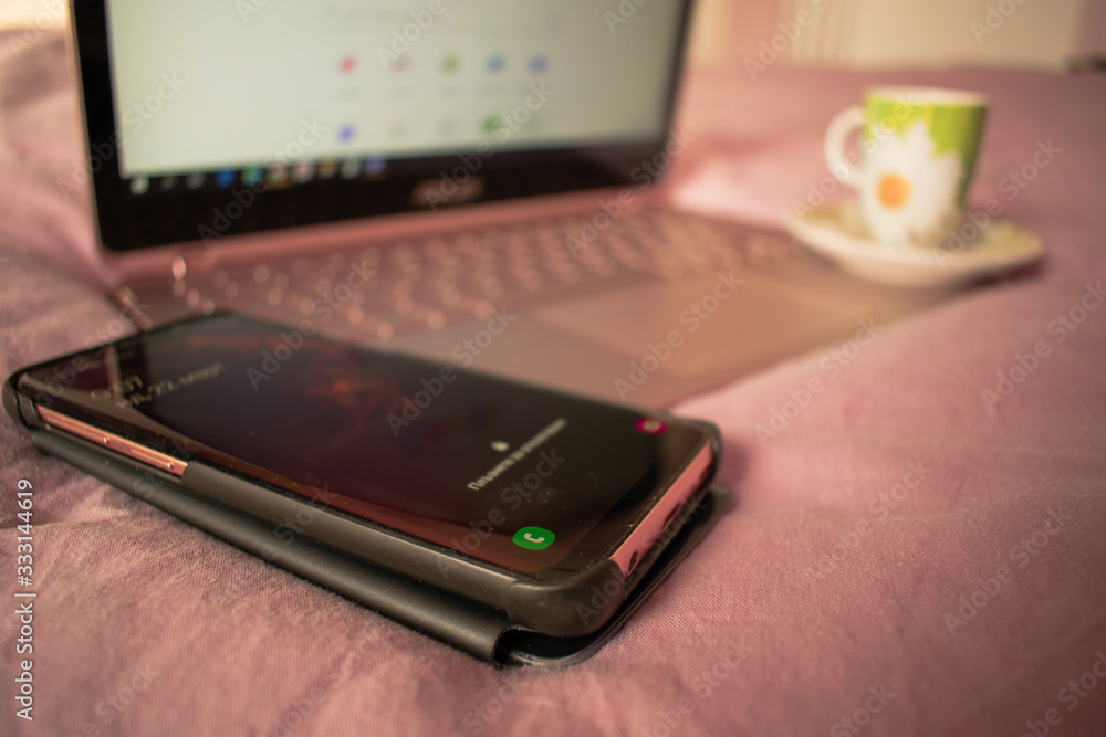 Sofia, Bulgaria - March 22, 2020. Cozy home office morning with a coffee cup. Stay home. Work from home.