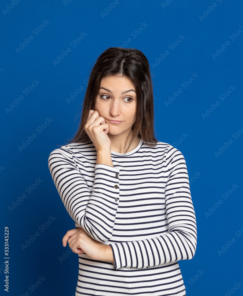 Brunette young woman wearing a striped T-shirt Brunette young woman wearing a striped T-shirt