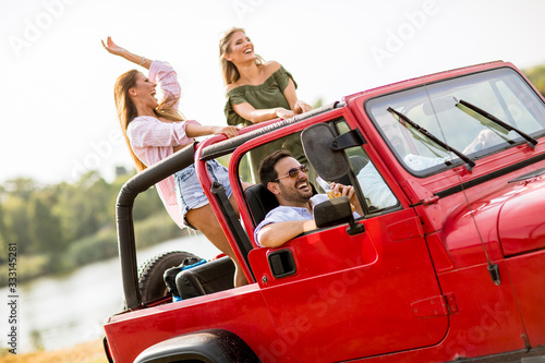 Group of young people enjoying road trip
