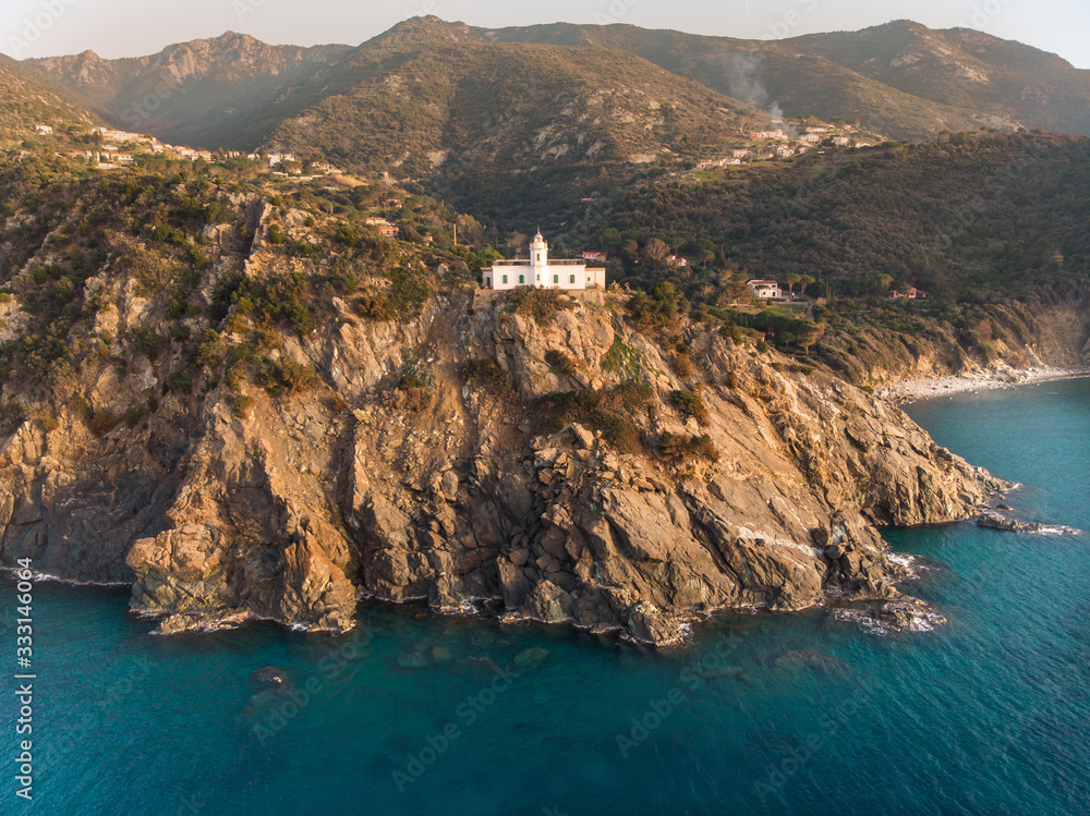Faro Punta Polveraia StockFoto Adobe Stock