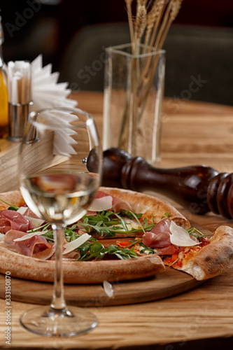 pizza with jamon and herbs