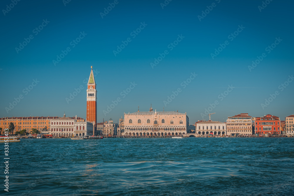 VENICE, VENETO / ITALY - DECEMBER 26 2019: Venice. San Marco tower view from the water