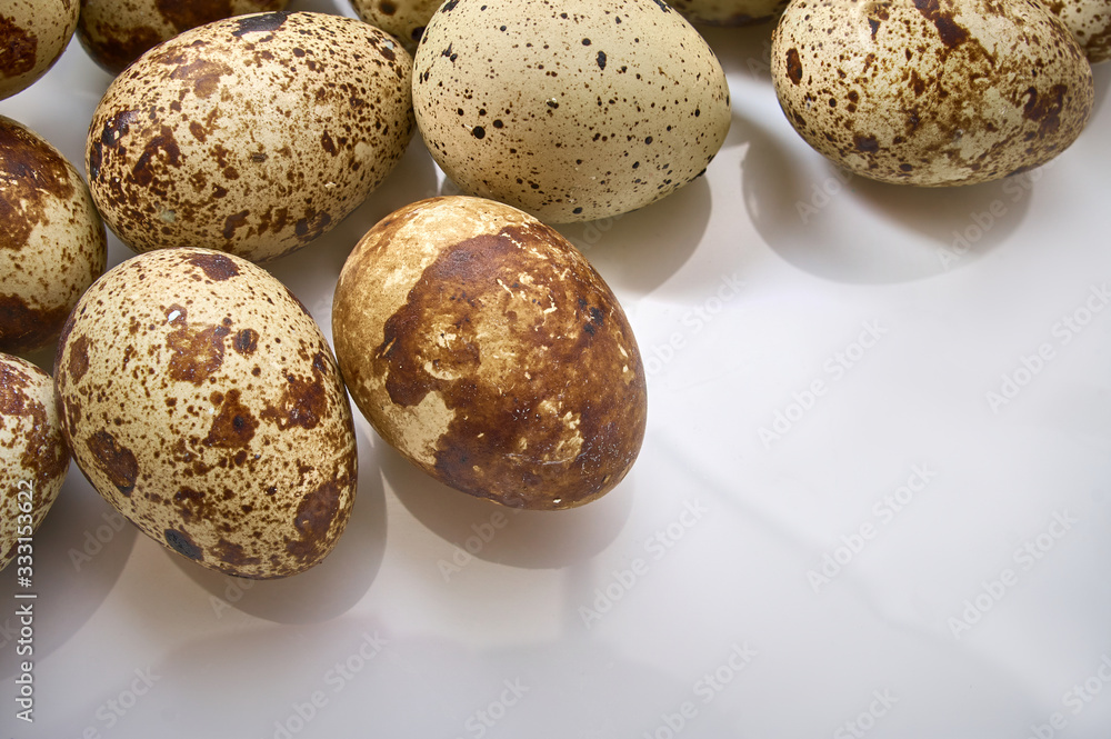Textured spring background with small quail eggs. Eco products. Textured spring background with small quail eggs. Eco products.