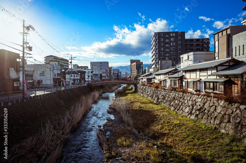 Wallpaper Mural Matsumoto, Japan - January 03, 2020: City View to the River and Buildings Torontodigital.ca
