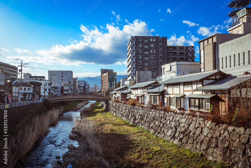 Yudanaka, Japan - January 05, 2020:  View to the mount River in the Small Station City near Nagano