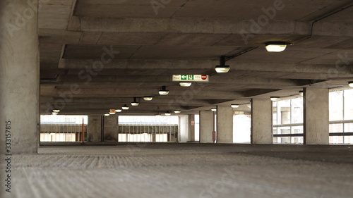Parking Garage - Empty parking garage with signage