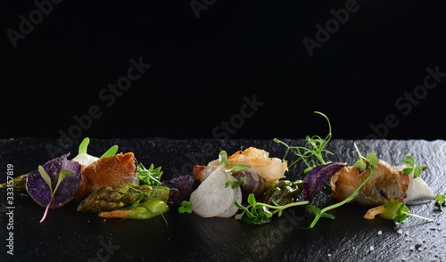 Fotografie Haute cuisine, Gourmet food scallops with asparagus and lardo bacon