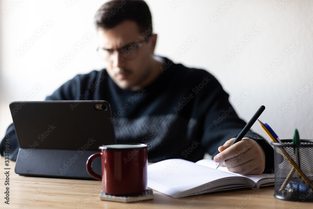 A busy man is focus on working at home A busy man is focus on working at home
