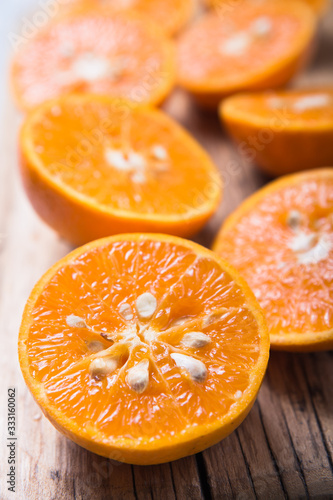 Fresh juisy chopped orange half pieces or tangerine food background
