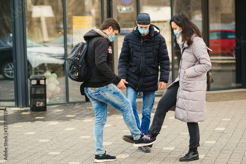People greeting with foots. Alternative handshake during coronavirus epidemic. Coronavirus prevention.