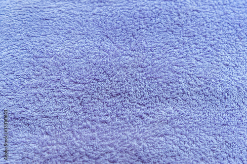 abstract background of bright purple terry towel close up